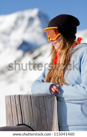 Snowboard, winter - portrait of young snowboarder girl on winter holidays