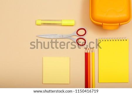 Note paper, felt pen, scissors, color pencils, lunch box and notebook