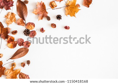 Autumn composition. Frame made of autumn dried leaves on white background. Flat lay, top view, copy space Royalty-Free Stock Photo #1150418168
