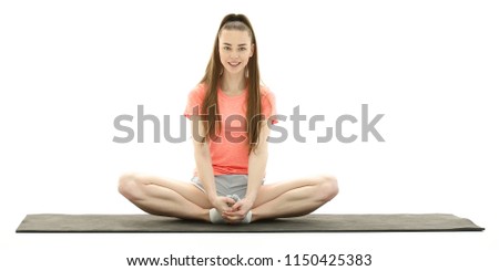 ractice of yoga. modern woman in sports clothing training yoga position