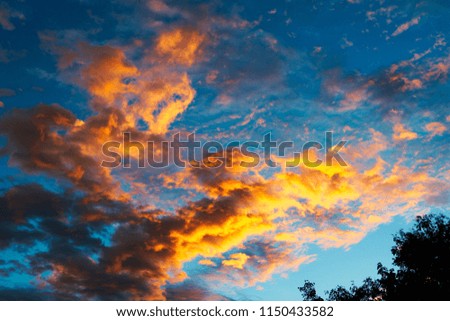on this great picture you can see the beautiful sunset over hua hin thailand. the clouds shine in rich red and orange