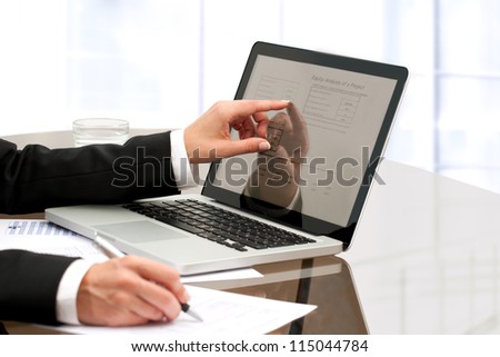 Female business hands working with laptop on table.
