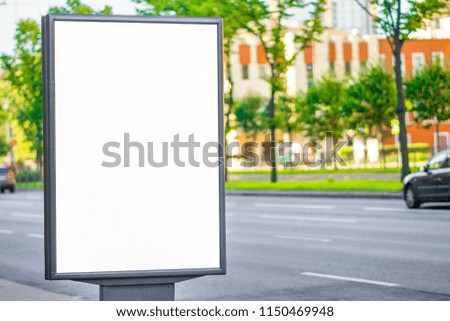Blank advertising panel on a street. lightbox advertising Blank Billboard on City Street in the afternoon near the road