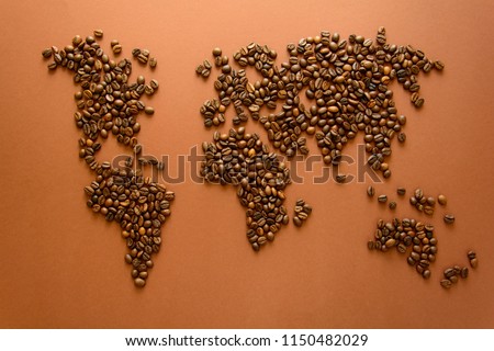 Map of the world made of roasted coffee beans on brown paper background. International coffee industry or travel planning concept Royalty-Free Stock Photo #1150482029