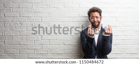 Young friendly business man sad and depressed, making a gesture of need, restoring to charity, concept of poverty and misery