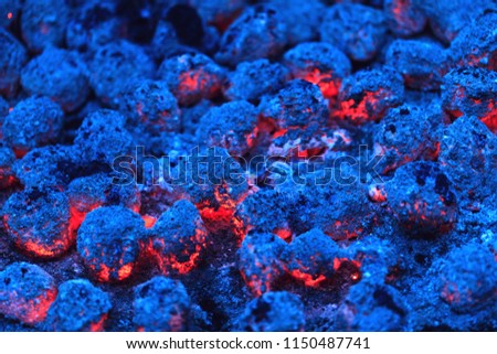 Colorful red and blue burning charcoal as best background for bbq grill pit, apocalypse or global warming concept. Conceptual picture for high temperature, lava and fire disaster. 