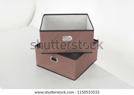 Textile storage box on white background