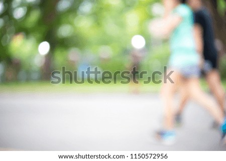 Abstract motion blurred of Healthy lifestyle jogging in the public park as concept. Closeup of feet or footwear.