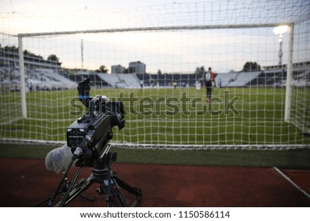 TV camera behind the football goal at the stadium during football matches