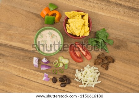 Taco Salad with Salsa Dressing ingredients on cutting board, overhead view