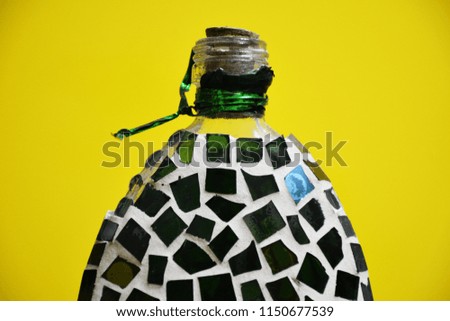 Glass jar on yellow background