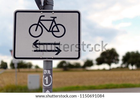 The label shows "Bicycle path". Road sign Bicycle path in two Directions, located in the Countryside.