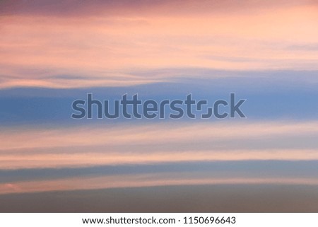 The sky is blue and orange, shape and motion of the cloud, beautiful color of the sky changes every day