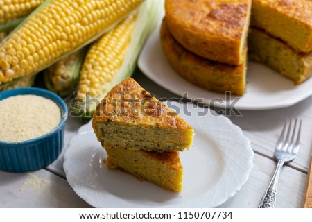 Fresh baked corn bread on wooden background Royalty-Free Stock Photo #1150707734