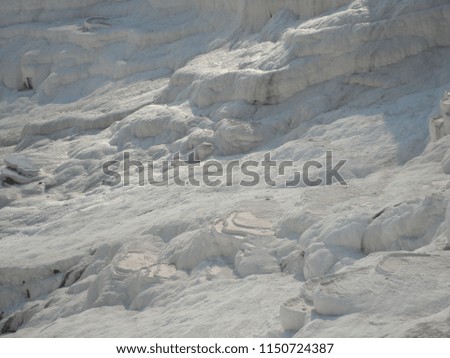 Travertines in Turkey. Calcite cliff of Pamukkale. Natural travertine pools and terraces, Pamukkale, Turkey. Fabulous natural beauty.