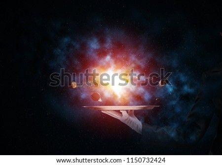 Cropped image of waitress's hand in white glove presenting glowing solar system on metal tray with dark cosmic background. 3D rendering.