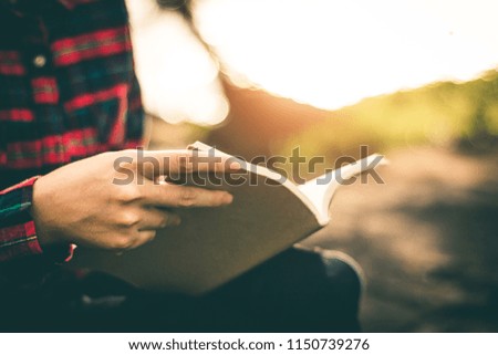 Women read books in quiet nature, concept read a books.