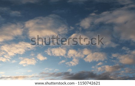 Mixed clouds background on a blue sky