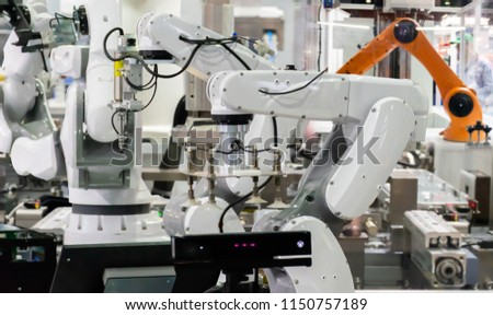Robot Industrial 4.0 of things technology robot arm and man using controller for control 