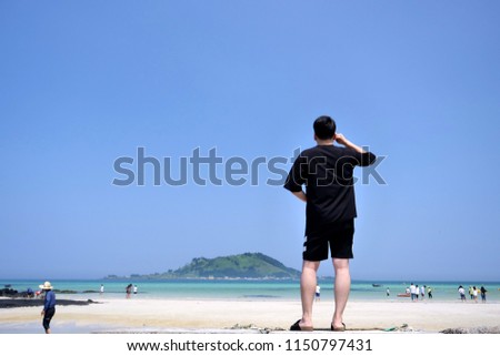 man look at the Hyeopjae Beach, Hyeopjae Beach, Jeju Island, Korea