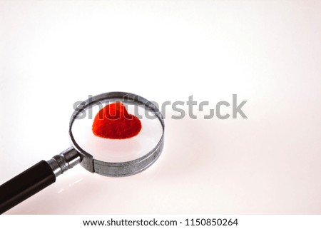 Old Magnifier and Red Heart On Isolated 