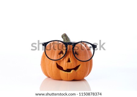 Carved smiling pumpkin Jack-o'-lantern with spectacles
on white background, Halloween