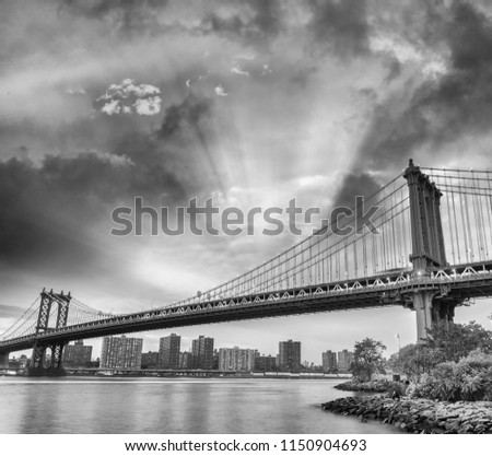 Manhattan Bridge at sunset in New York City, USA.