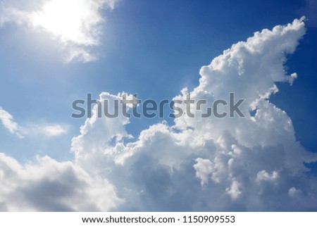 Blue sky with clouds on sunny day.