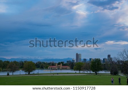 Afternoon cloudy view of the downtown skyline from city park at Denver, Colorado