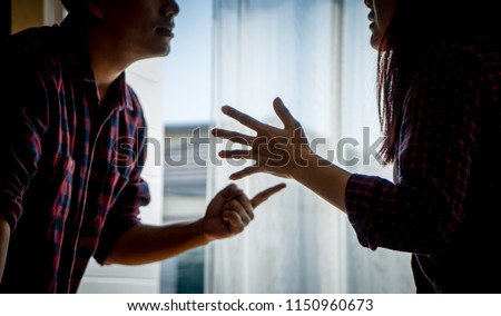 Co worker or Love Couple is fighting and arguing with Anger Dark Emotion for disagreement and family conflict concept. Husband and wife pointing and blaming each other. Royalty-Free Stock Photo #1150960673