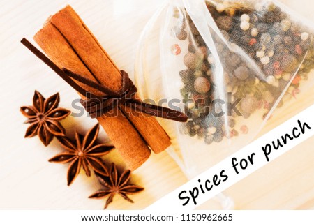 Anise, cinnamon, pepper and ingredients for preparation mulled wine, closeup on wooden background.Top view flat lay copy space with text spices.