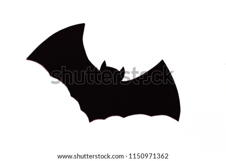 Single flying bat in black color, placed at the center of frame over a white background, giving symbol of Halloween.