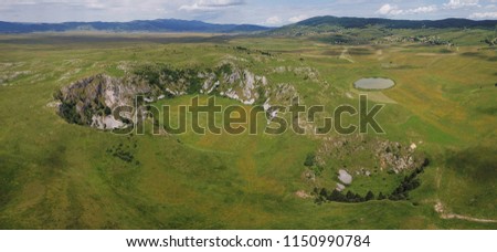 On the Kupres Polje (Kupreško polje) within Dinaric karst of western Bosnia and Herzegovina is a group of collapse sinkholes (collapse dolines) which are known as Japage. Royalty-Free Stock Photo #1150990784