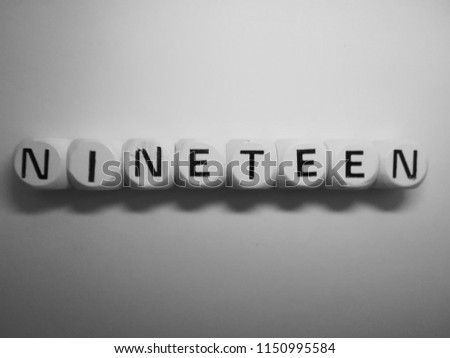 word nineteen spelled in dice