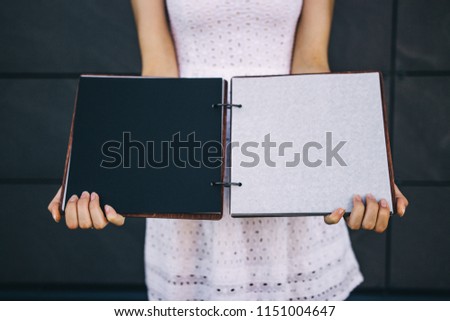 A book with a wooden cover with empty pages.