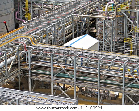Industrial construction of structural steel, pipe racks and cable racks Royalty-Free Stock Photo #115100521