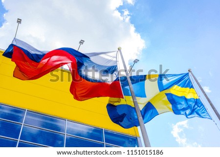 Flag of Russia and Sweden near store in Moscow