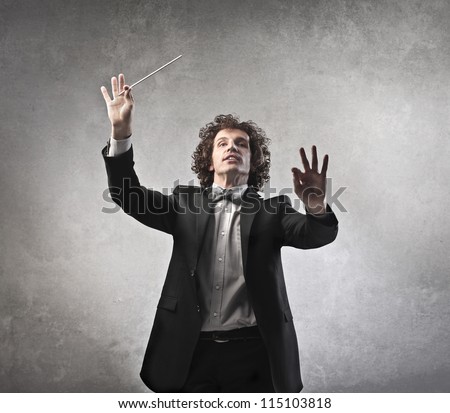 Man conducting an orchestra Royalty-Free Stock Photo #115103818