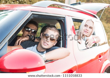 Happy couple driving on a car. Concept about transportation and love