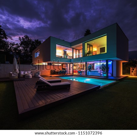Modern villa with colored led lights at night. Nobody inside Royalty-Free Stock Photo #1151072396