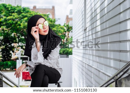 Woman in a Muslim scarf hijab