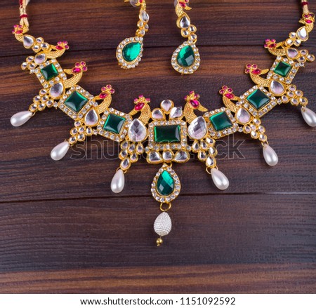 
Close up of diamond Jewellery Necklace on texture background. Indian Traditional jewelry.
