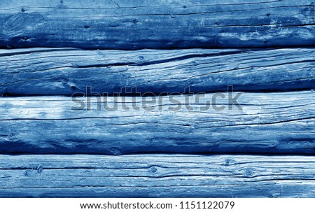Old grunge wooden fence pattern in navy blue tone. Abstract background and texture for design.