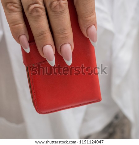 Beautiful manicure, women's hands, handbag

