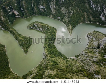 The Uvac gorge in southern Serbia is especially known for entrenched meanders in a 100 m (330 ft) deep canyon. It is a nature reserve for the preservation of the griffon vulture.