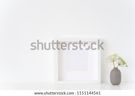Minimal white square frame mock up with a Aegopodium in gray vase. Mockup for quote, promotion, headline, design. Template for small businesses, lifestyle bloggers, social media