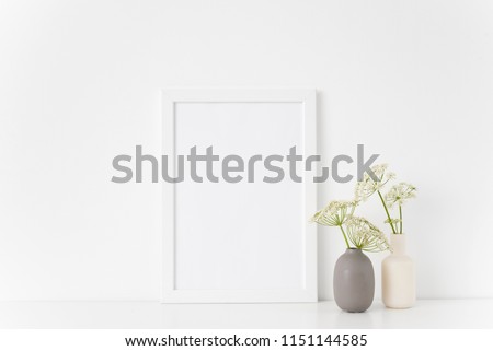Cute summer white portrait a4 frame mock up with a episcopal weed in gray and white vases on white background. Mockup for quote, promotion, headline, design. Template for small businesses, lifestyle