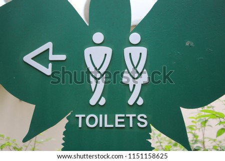 the public toilet sign in the park