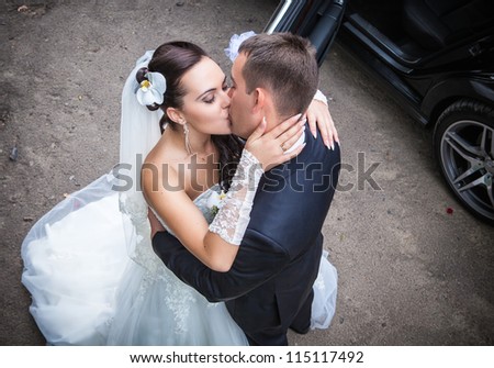 Wedding shot of bride and groom in park Royalty-Free Stock Photo #115117492