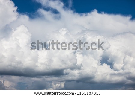 stormy rainy clouds over blue sky. Nature landscape background